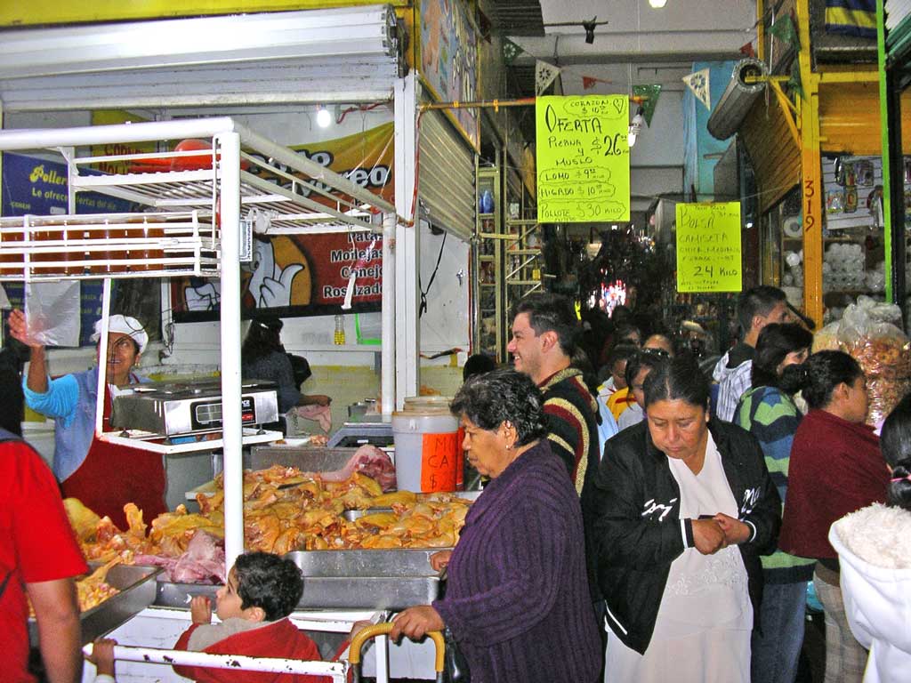 Shoppers crowd the aisles at Morelia's Mercado Independencia in front of one of the poultry vendors. Yes, this is where I buy my chicken, rabbit, etc. whenever I can. 