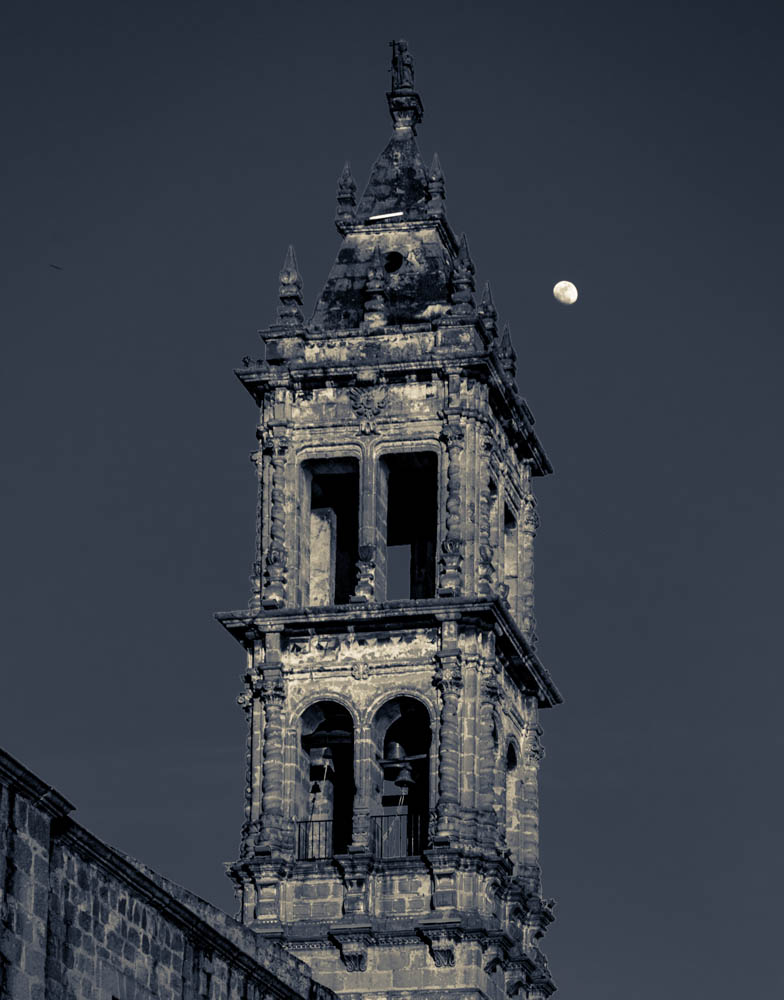 Moonlit spire by day