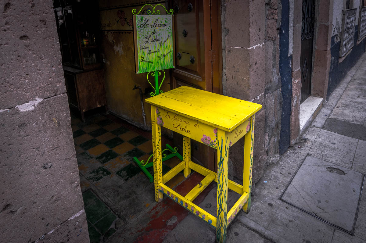 Just a yellow table at the door